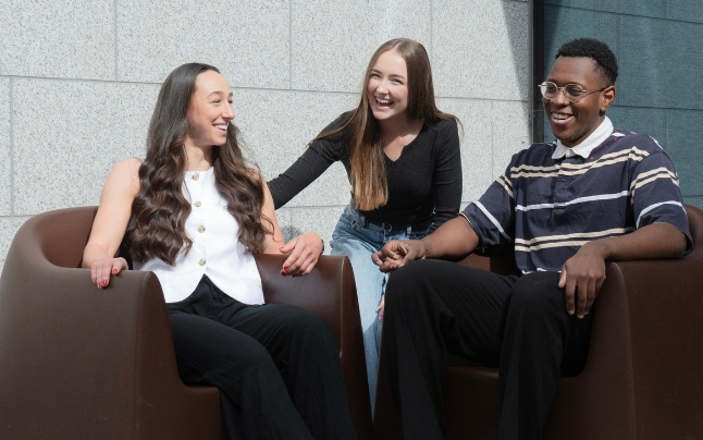 Sisters Damilola and Tunrayo Olufemi share a laugh in Front Square, Trinity College Dublin during a nice summer day